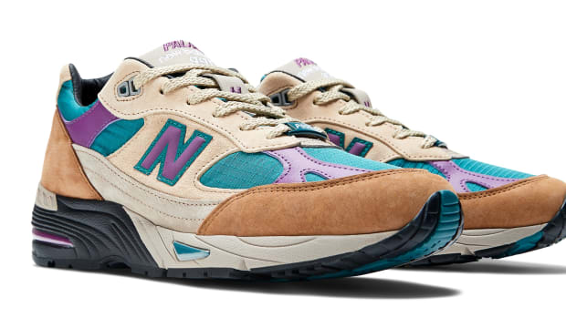 Side view of brown, purple, and teal New Balance shoes.